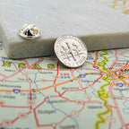American Dime silver coin lapel pin with a map of the United States in the background