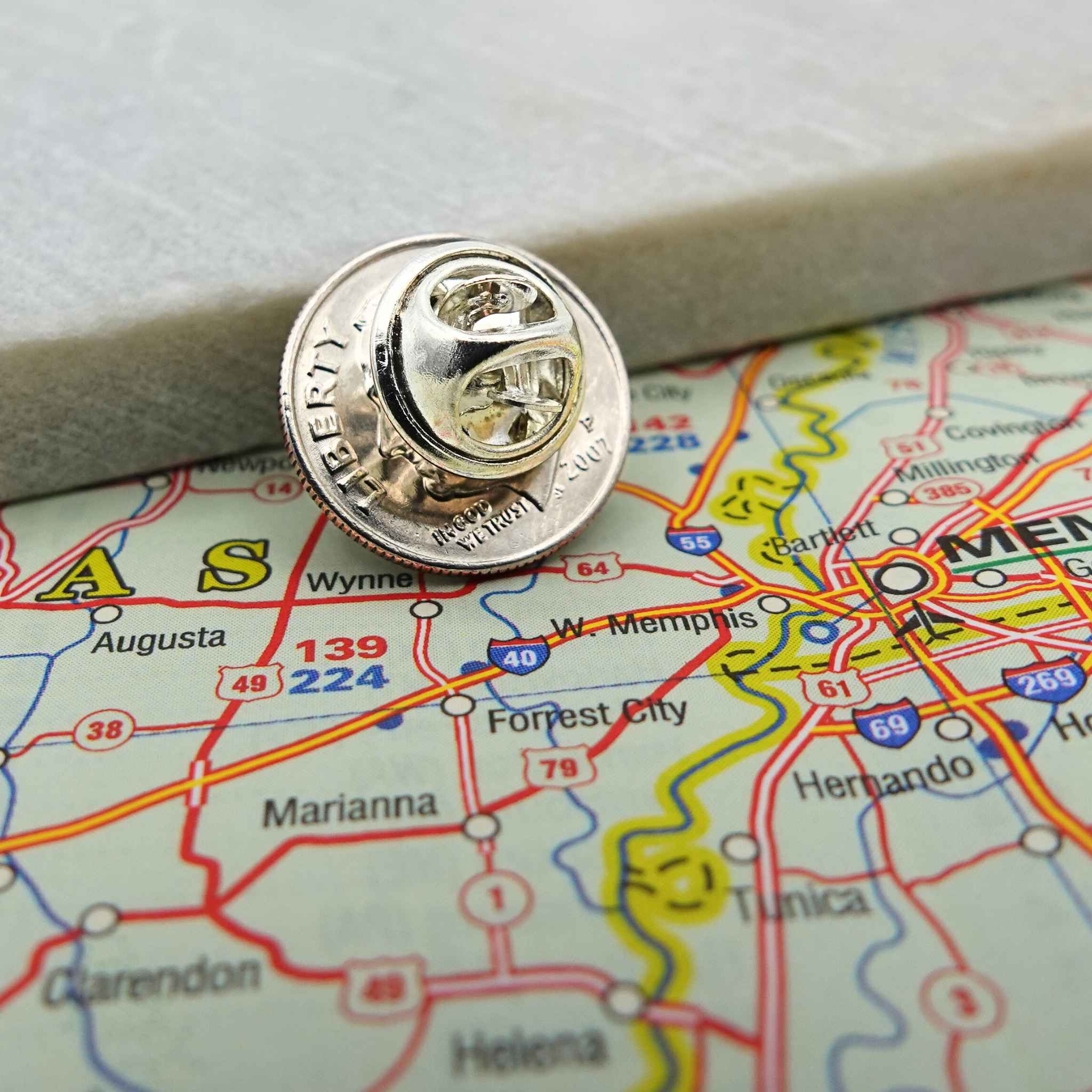 American Dime silver coin lapel pin (reverse with clip) with a map of the United States in the background