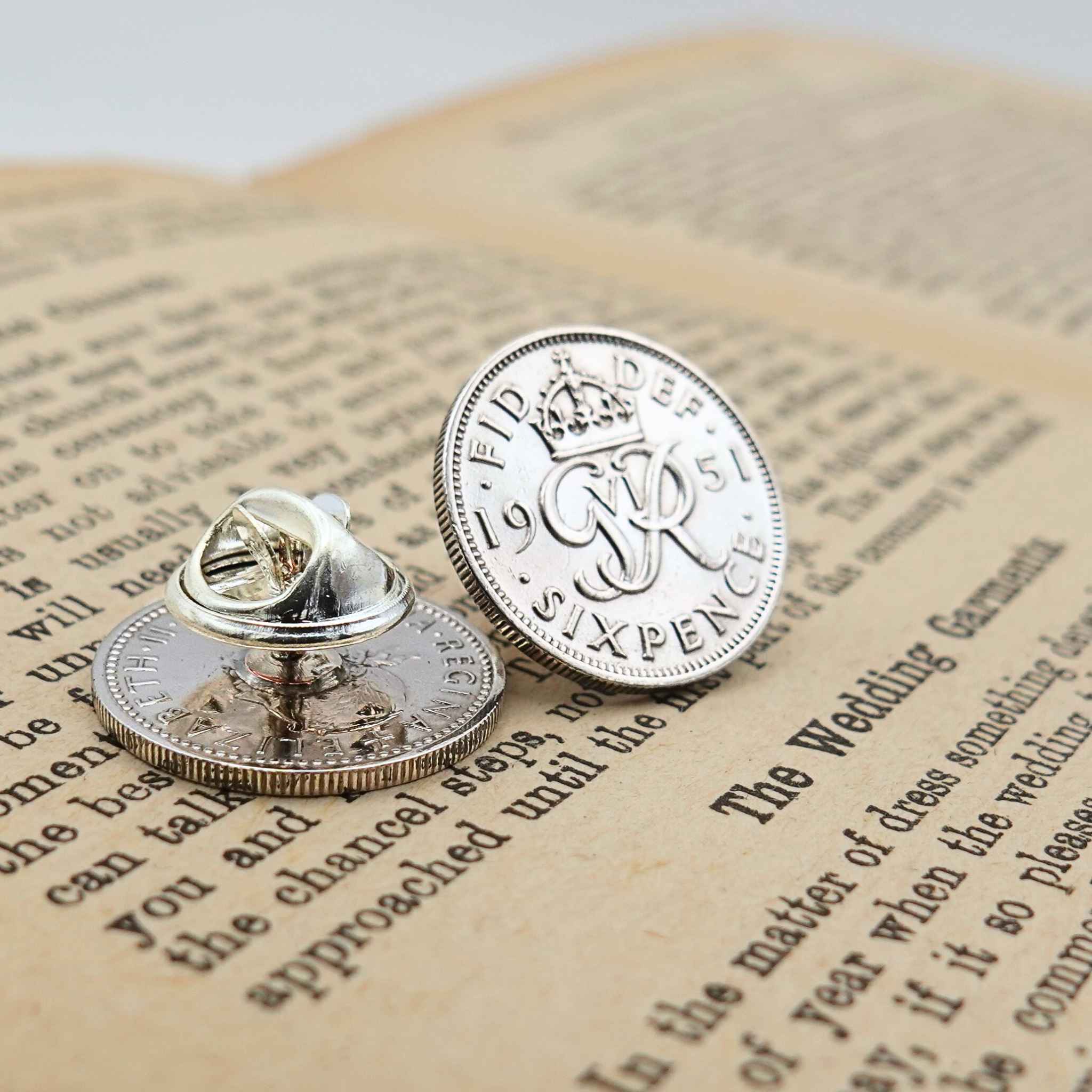 Two british sixpence coin lapel pins showing King George 6th mint design
