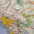 Map of Southern California with a silver American Dime coin tie pin