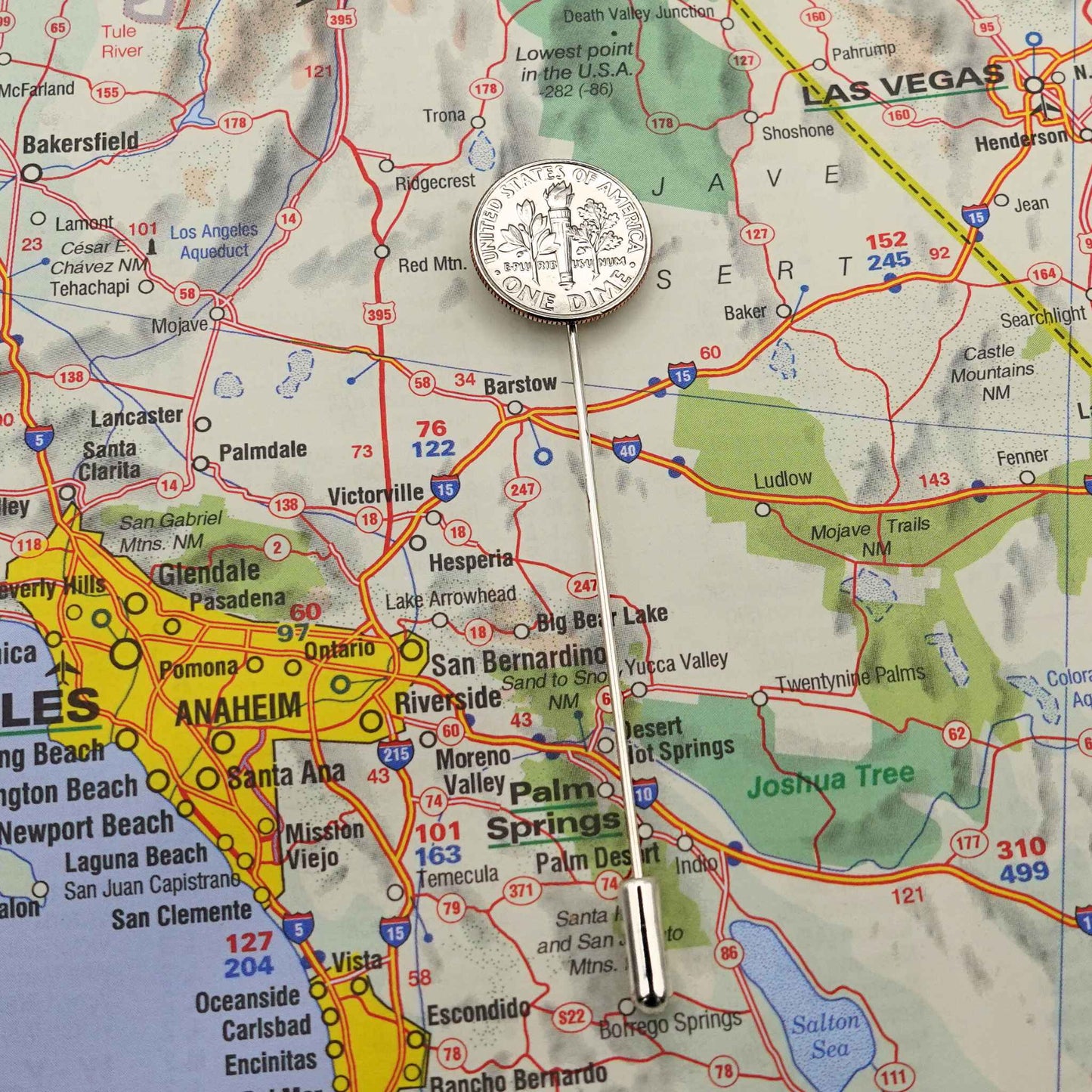 Map of Southern California with a silver American Dime coin tie pin