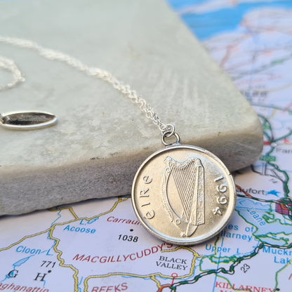 Silver Irish 5p coin necklace with a harp design on a map background