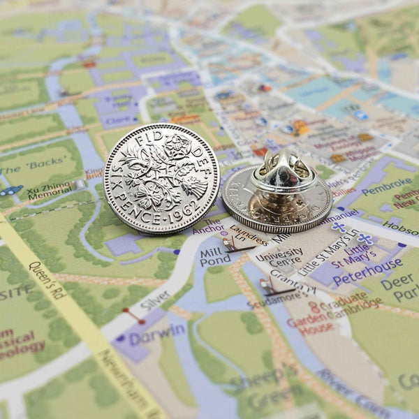 Two British sixpence coin lapel pins showing silver plated butterfly back