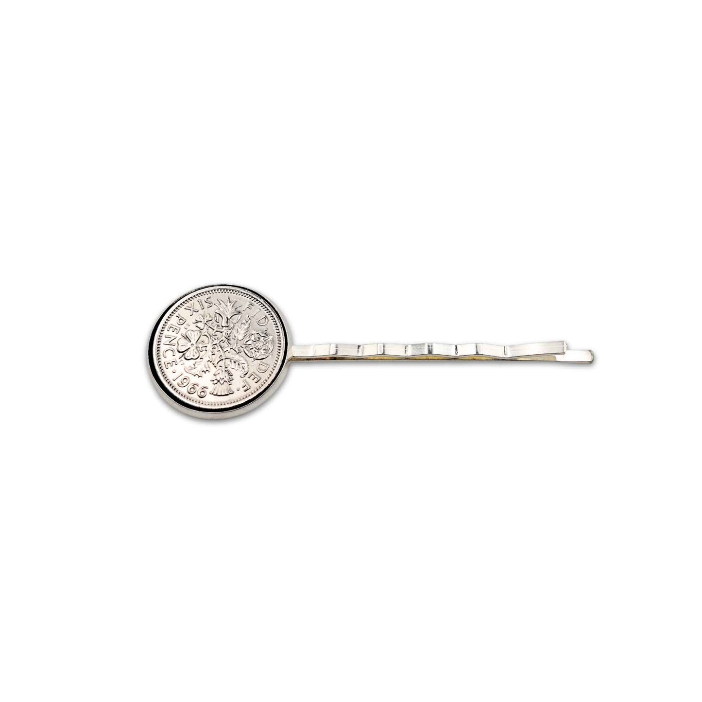 Silver plated hair slide with jewellery grade resin finish sixpence coin design on a white background