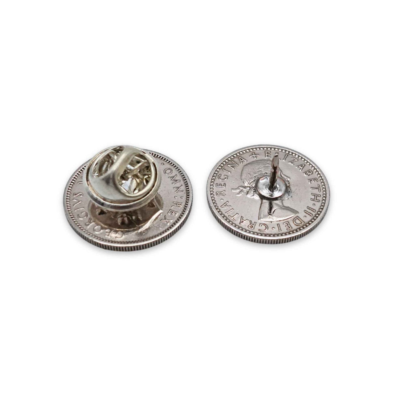 Two british sixpence coin lapel pins showing the backs with silver plated butterfly clasp