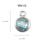 Silver pendant with a blue gemstone, labeled 'March', on a white background.