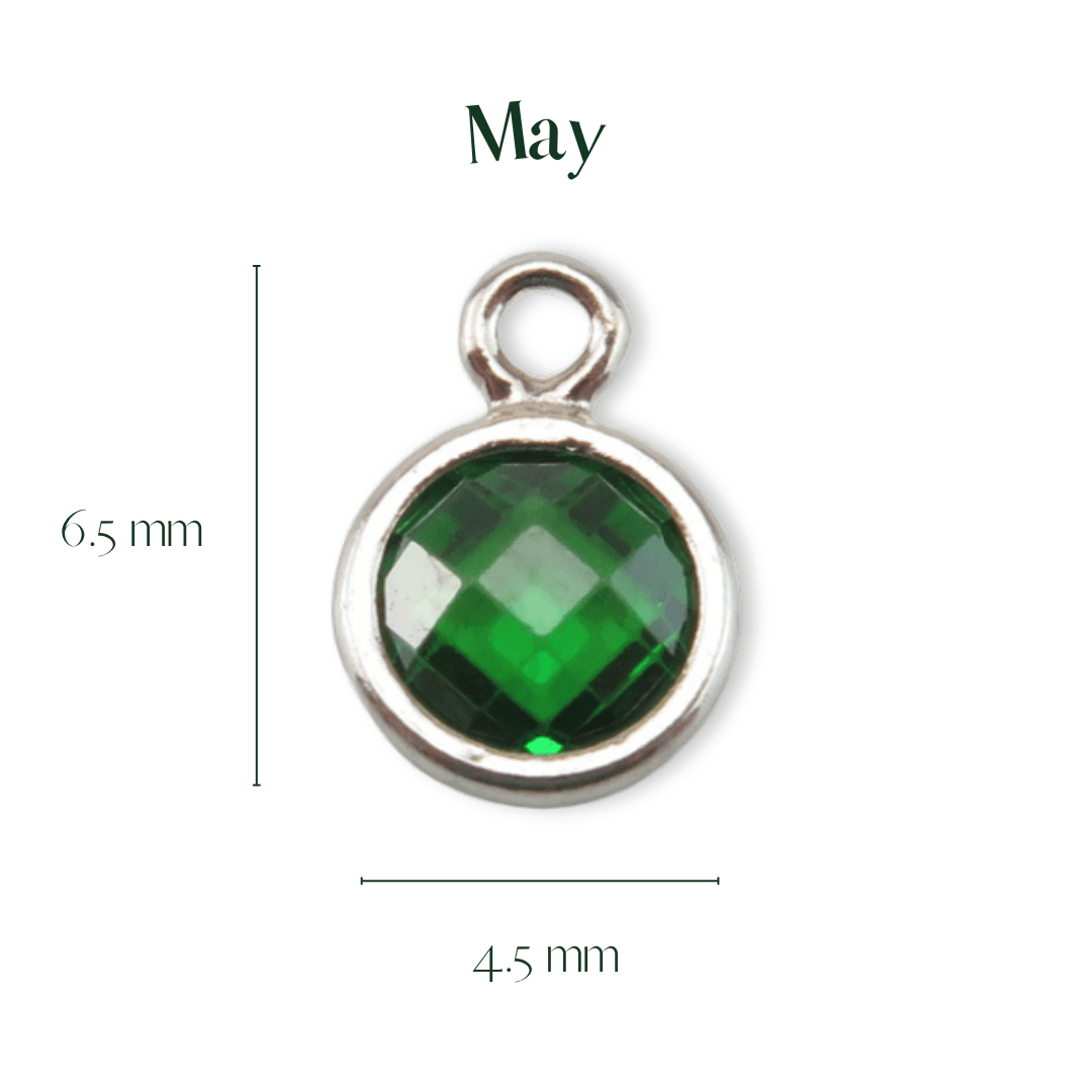Green gemstone pendant with silver frame and measurements on a white background