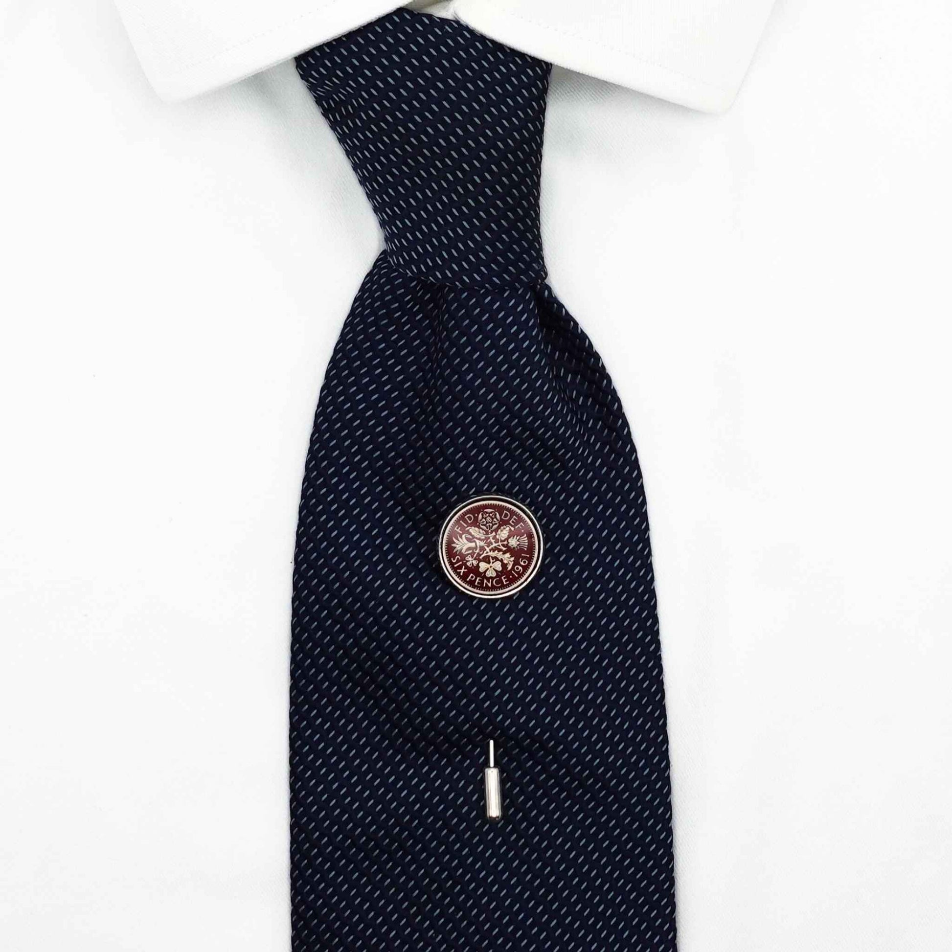 British sixpence coin red enamel silver plated tie pin on navy tie, white shirt in background