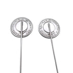 Two silver biritsh sixpence coin tie pins showing the backs on a white background