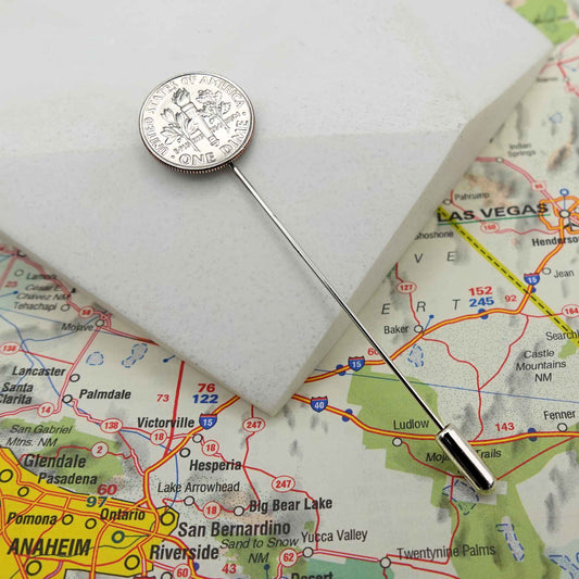 Silver US Dime coin lapel pin on a map of California with cities like Las Vegas, Anaheim, and San Bernardino.