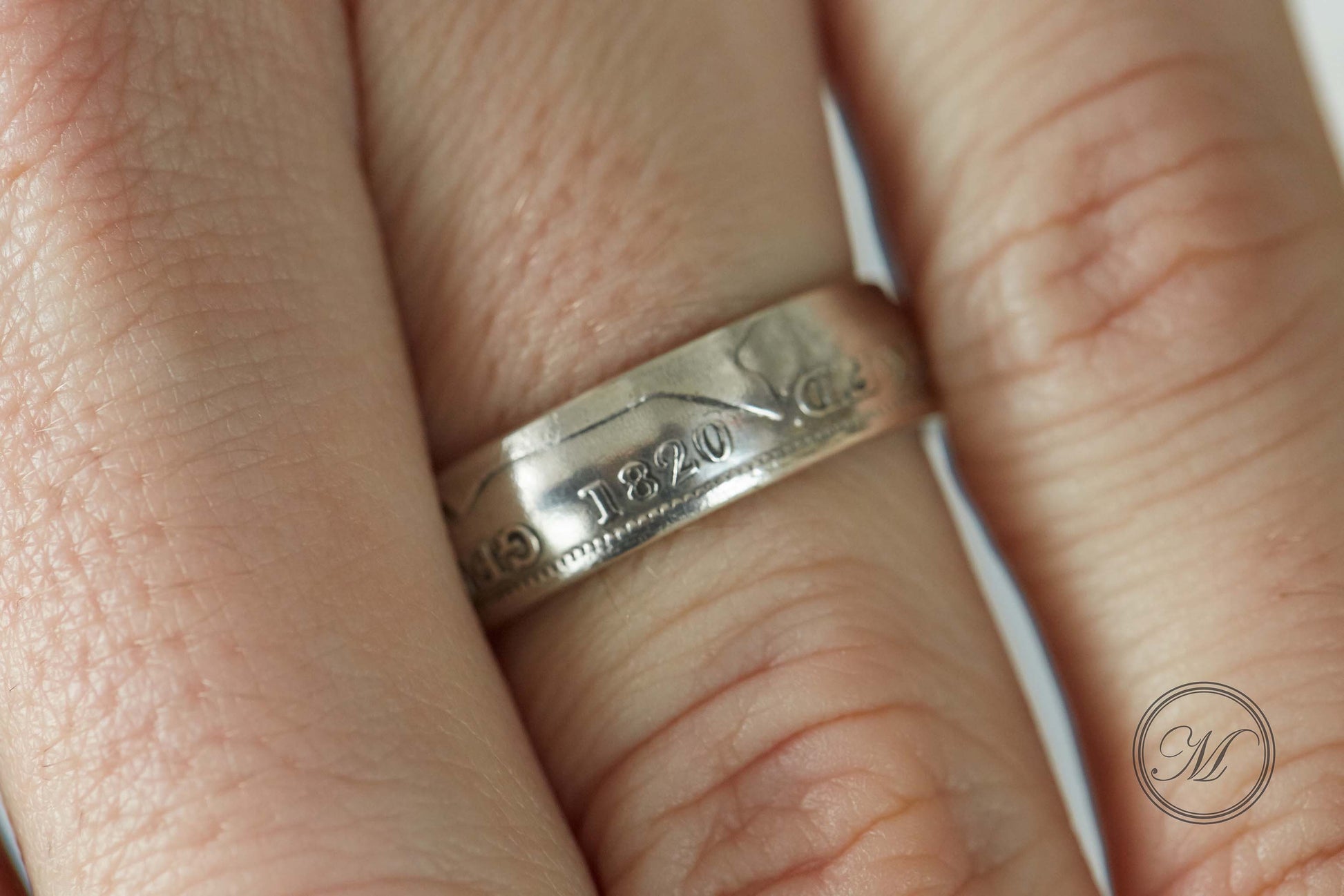 1820 shilling coin ring close up on finger