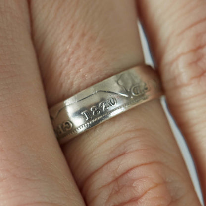 1820 shilling coin ring close up on finger
