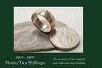 1910 florin coin ring on stone with coin
