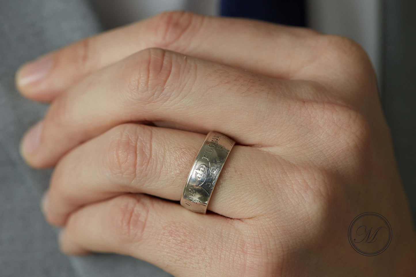 Florin coin ring close up on ring finger